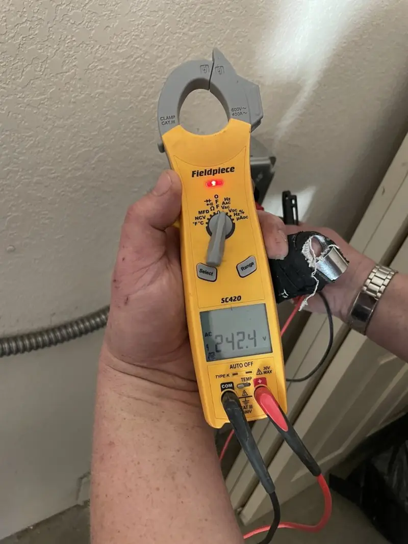 Voltage testing with clamp meter during Electrical Installation Services in Seven Corners